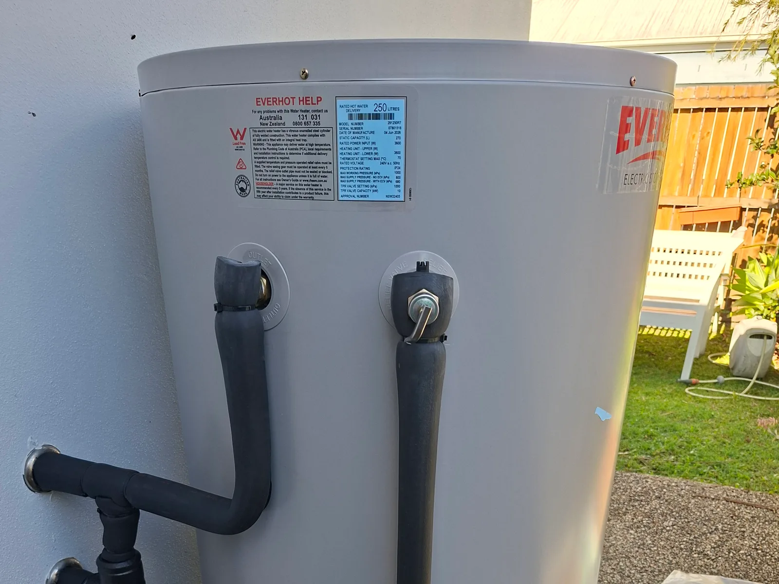 An Everhot 250 litre electric storage tank installed by RCM beside a Sunshine Coast home, data plate and connections visible