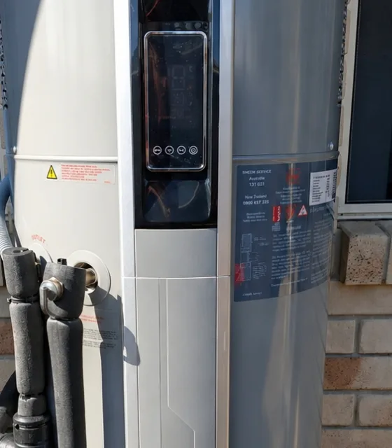 The controller and compliance plate on a Rheem heat pump installed by RCM