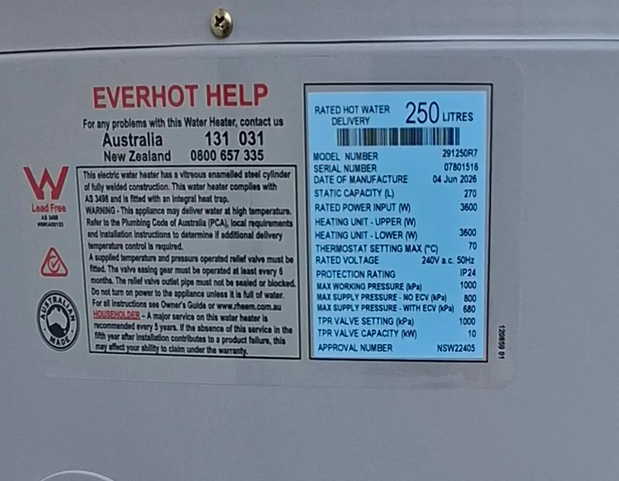 The data plate on a hot water storage tank, showing model, serial number and capacity