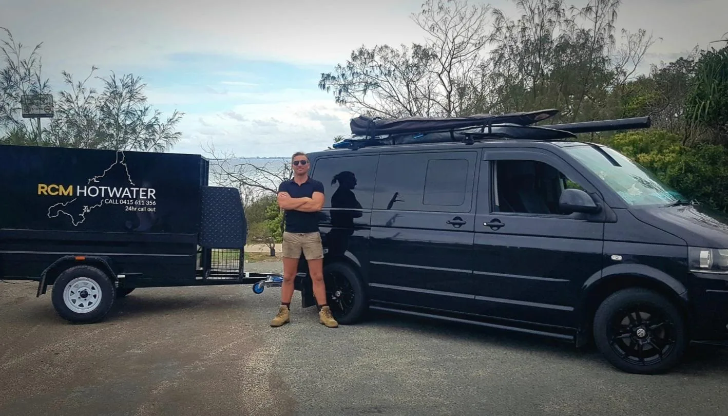 Richard from RCM Hot Water with the branded work van and trailer on the Sunshine Coast