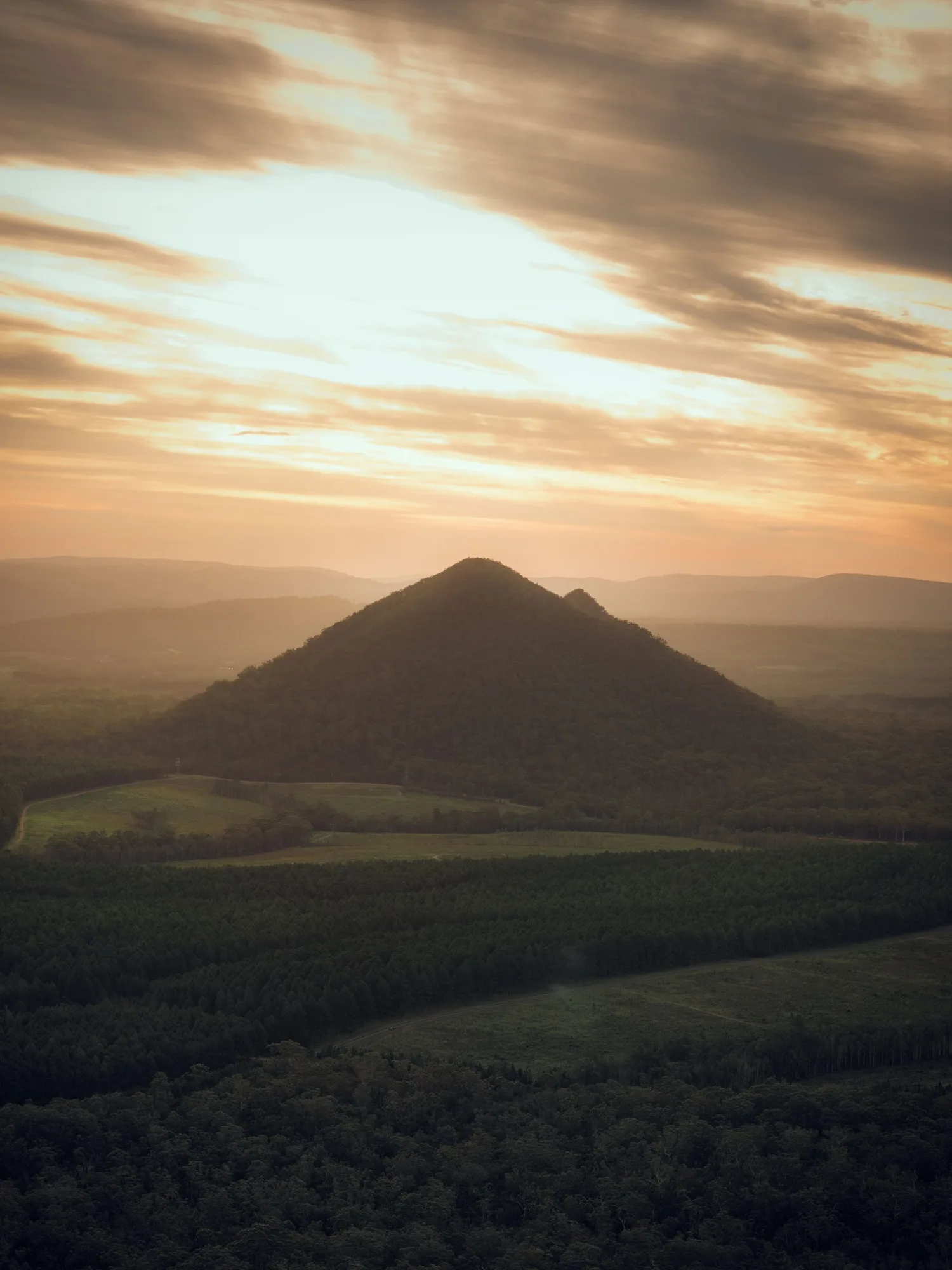 Aerial view of the Glass House Mountains at sunset