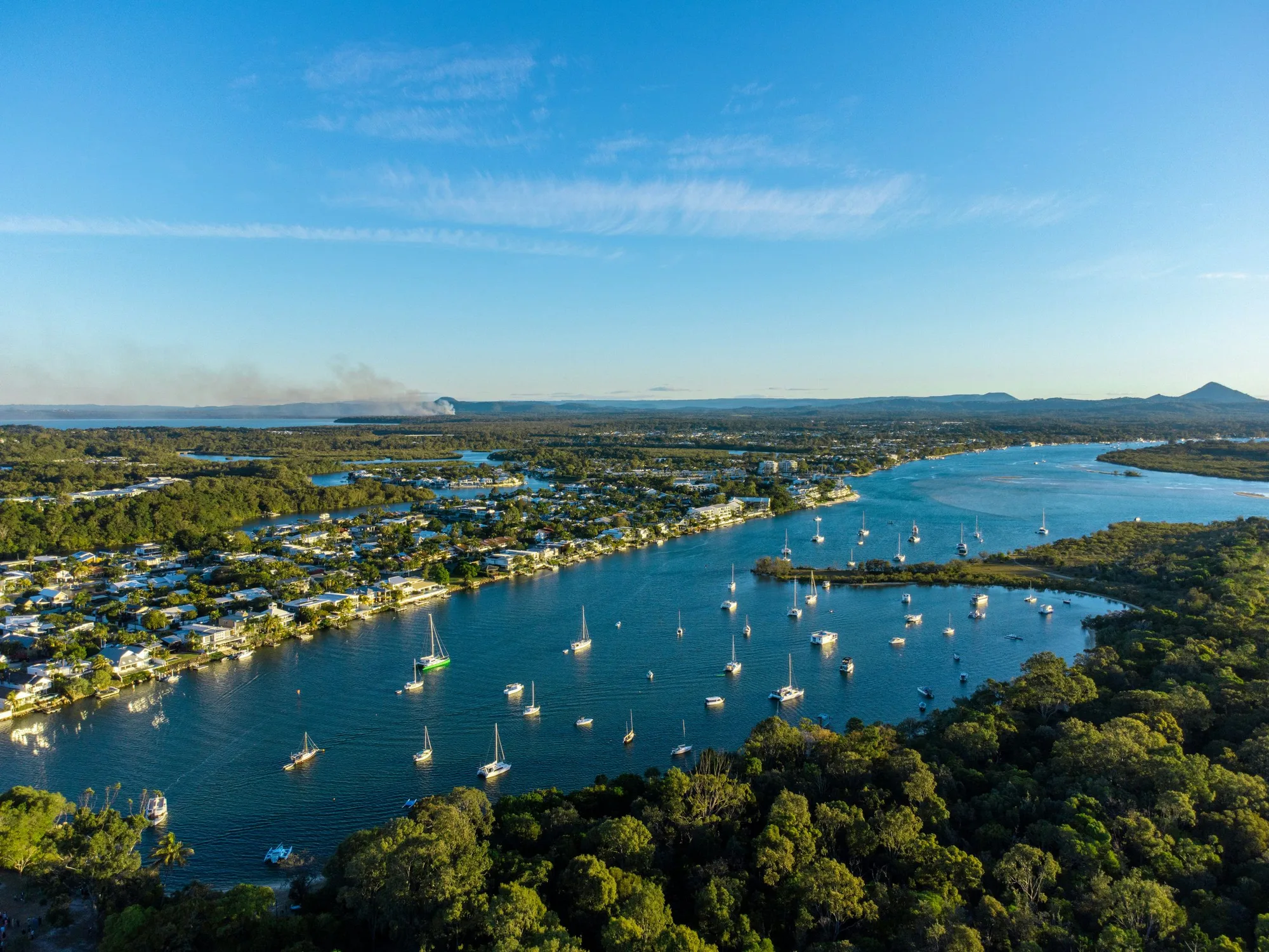 Aerial view of the Noosa River and Noosa Heads, with boats moored along the river
